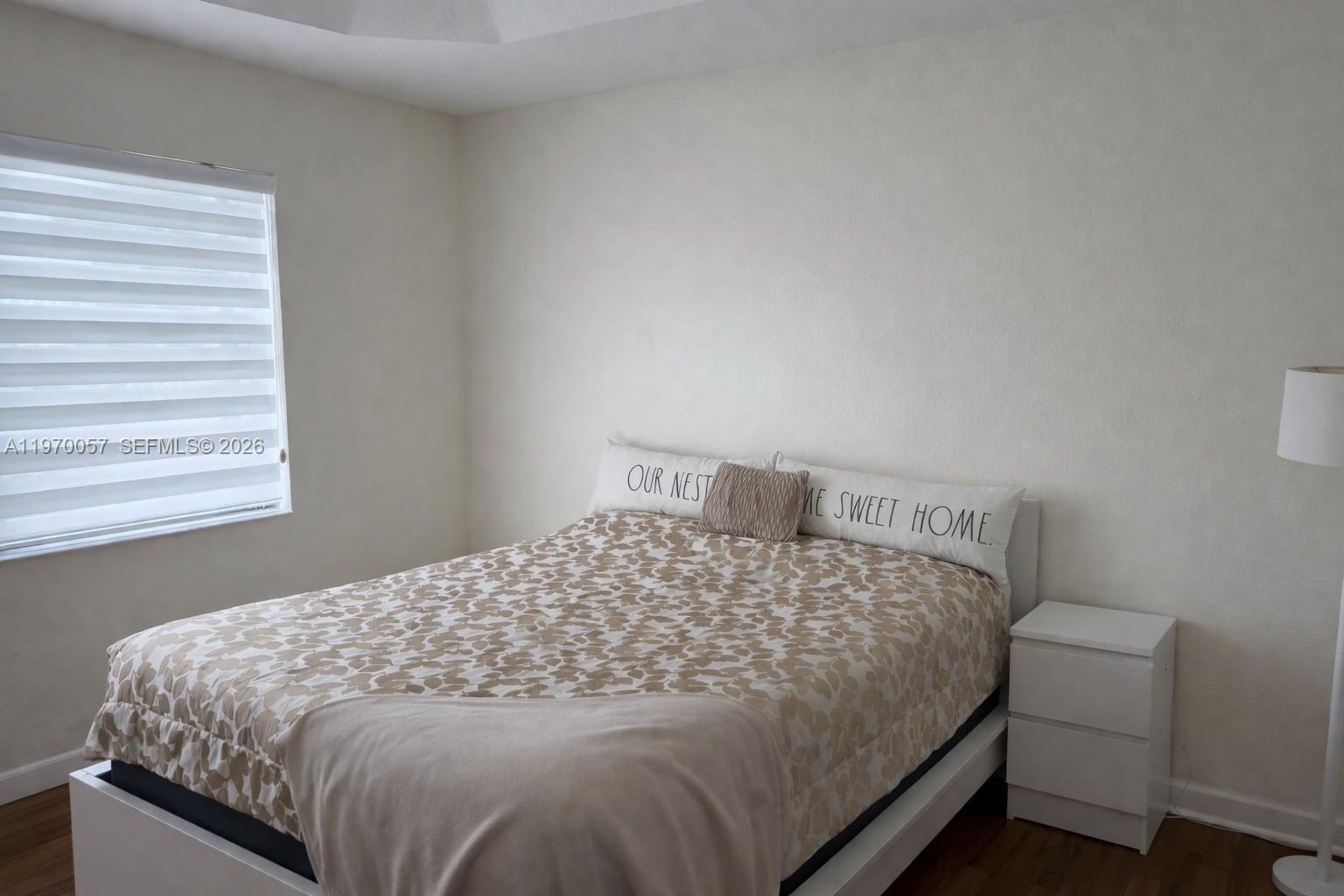 1485 Northeast 33rd Road, Unit 207 Homestead, FL 33033 - Photo 9 of 10 a bedroom with a bed and window