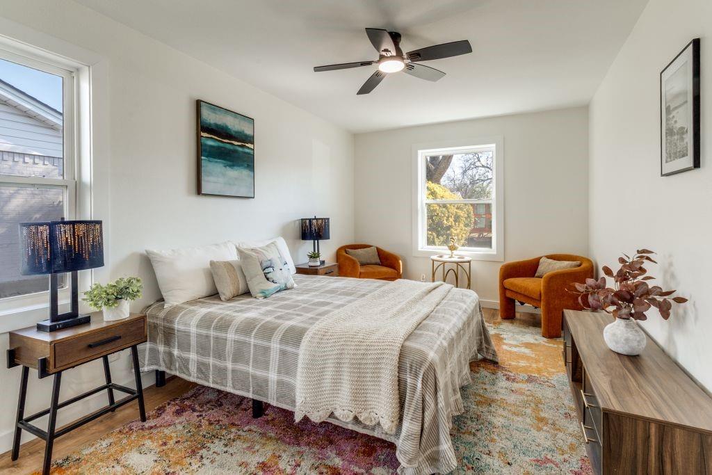 3121 Damascus Way Farmers Branch, TX 75234 - Photo 16 of 25 a bedroom with a bed a dresser and a window