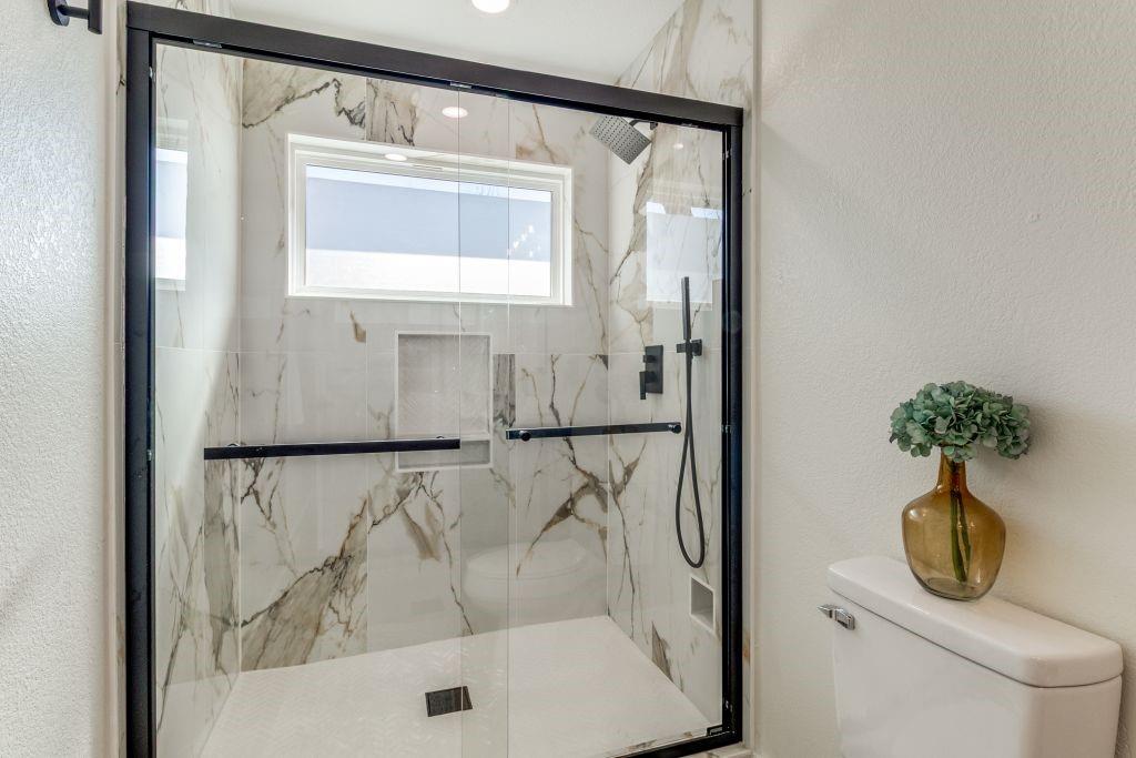 3121 Damascus Way Farmers Branch, TX 75234 - Photo 19 of 25 a bathroom with a shower and a mirror