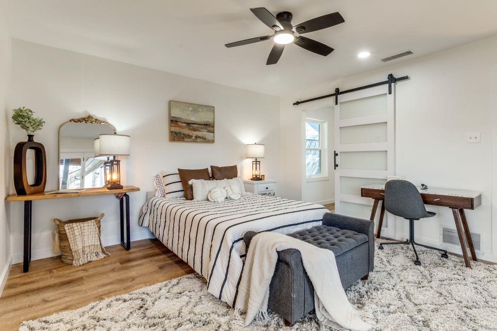 3121 Damascus Way Farmers Branch, TX 75234 - Photo 20 of 25 a bedroom with a bed and a chair