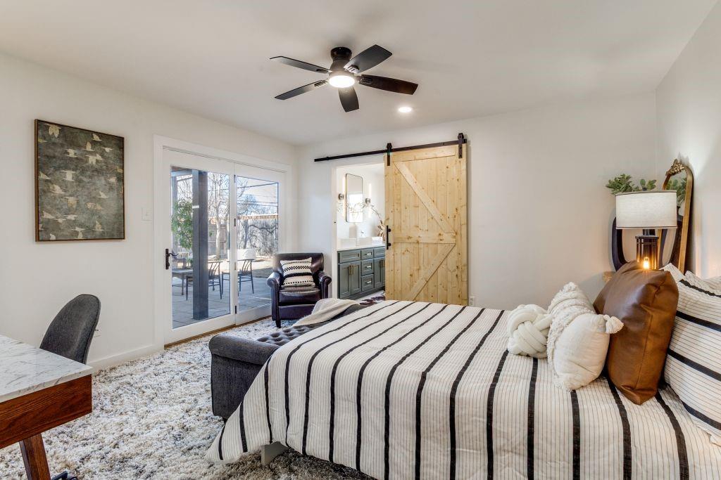 3121 Damascus Way Farmers Branch, TX 75234 - Photo 21 of 25 a bedroom with a bed gym equipment and a window