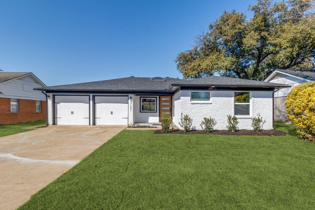 3121 Damascus Way Farmers Branch, TX 75234 - Photo 4 of 25 a front view of a house with a garden and yard
