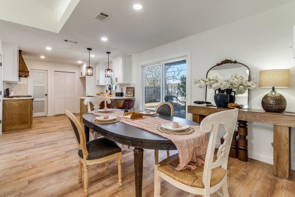 3121 Damascus Way Farmers Branch, TX 75234 - Photo 10 of 25 a view of a dining room with furniture and wooden floor
