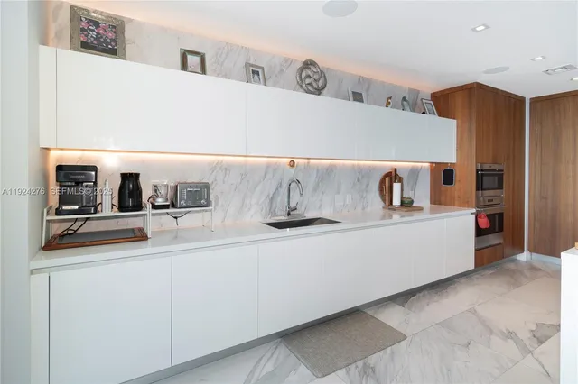 a bedroom with a bed and a painting