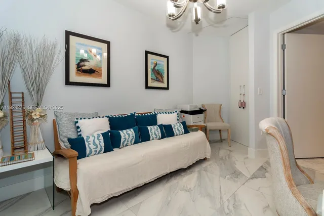 a bed room with a bed and a chair