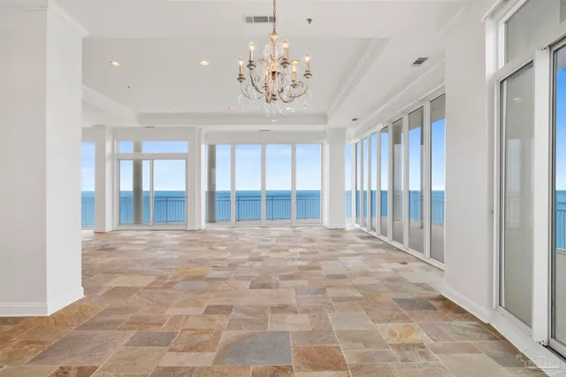 a view of an empty room with a chandelier