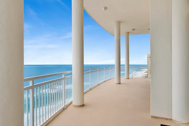a view of a kitchen with refrigerator and window