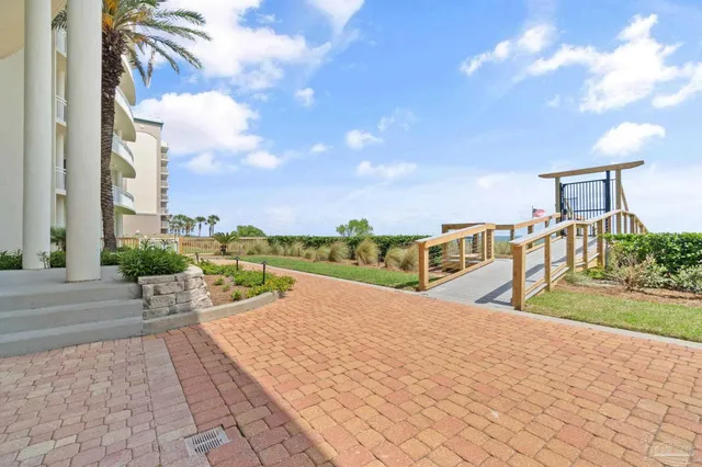 a view of a garden with a lounge chair