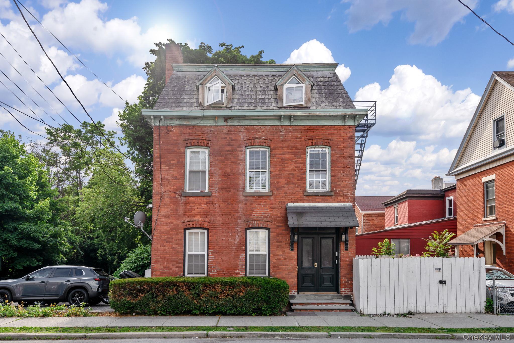 32 North Bridge Street Poughkeepsie, NY 12601 - Photo 2 of 19 a front view of a house with a garden