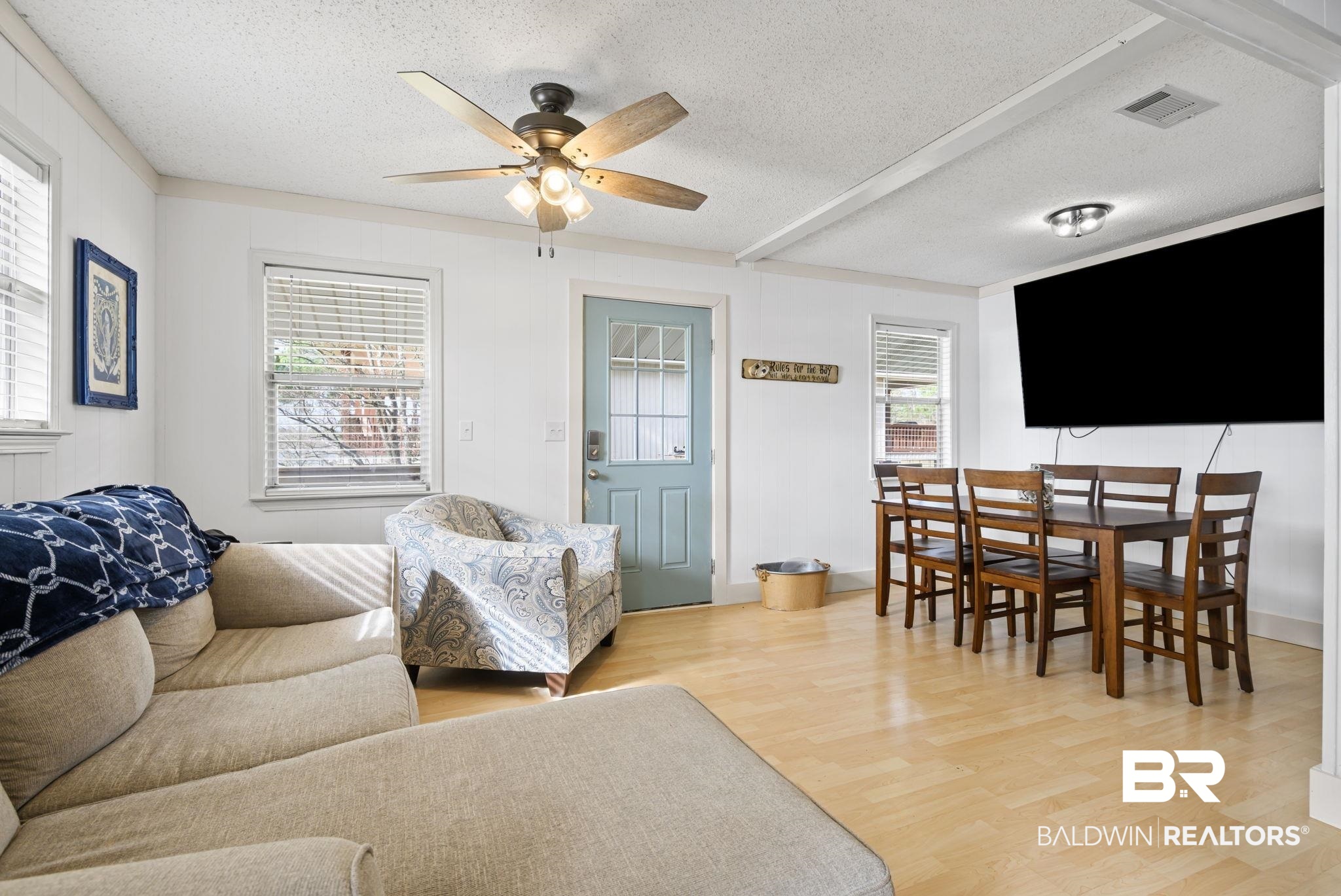7947 Bayshore Drive Elberta, AL 36530 - Photo 14 of 26 Living room featuring light wood-style flooring, a textured ceiling, and a ceiling fan