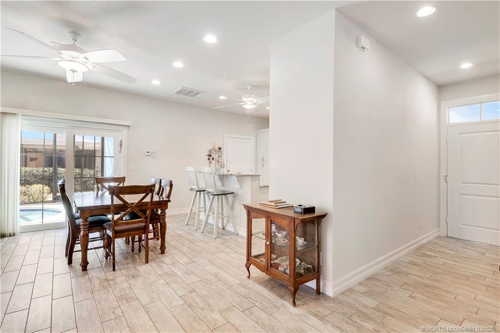 5352 Southeast Nassau Terrace Stuart, FL 34997 - Photo 20 of 53 a view of a dining room with furniture and wooden floor
