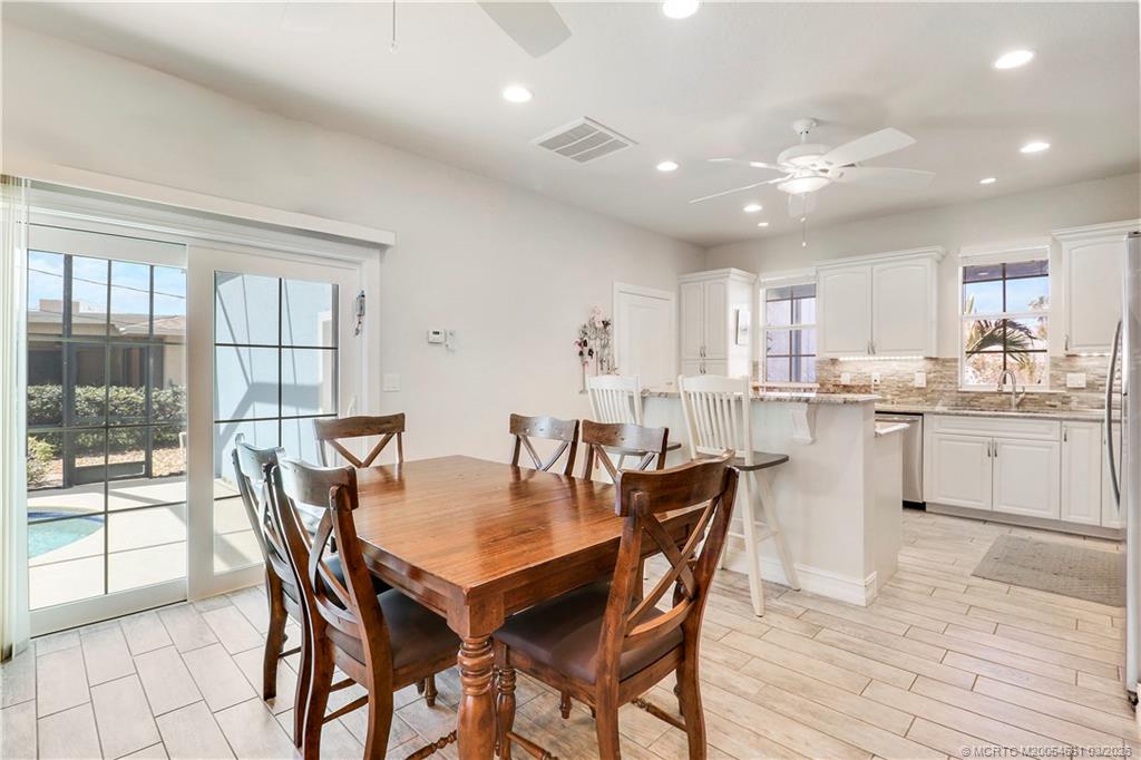 5352 Southeast Nassau Terrace Stuart, FL 34997 - Photo 21 of 53 a dining room with furniture and window