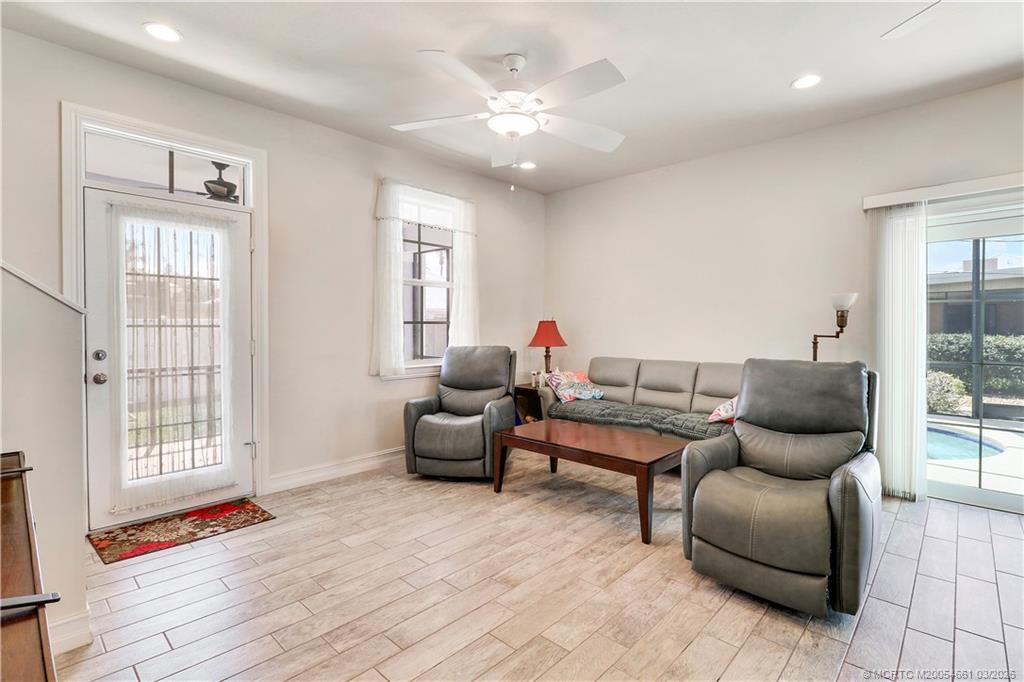 5352 Southeast Nassau Terrace Stuart, FL 34997 - Photo 23 of 53 a living room with furniture and wooden floor
