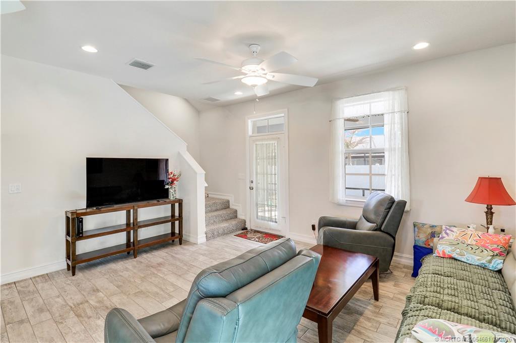 5352 Southeast Nassau Terrace Stuart, FL 34997 - Photo 25 of 53 a living room with furniture and a flat screen tv