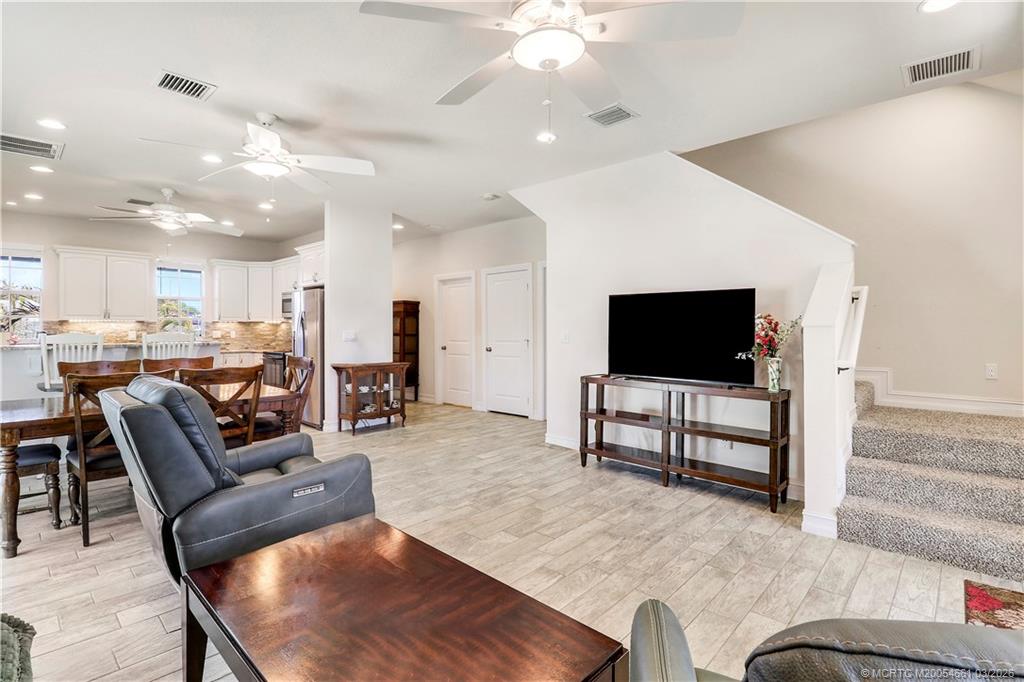 5352 Southeast Nassau Terrace Stuart, FL 34997 - Photo 26 of 53 a living room with furniture and a flat screen tv
