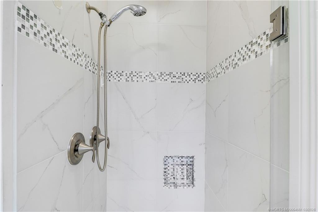 5352 Southeast Nassau Terrace Stuart, FL 34997 - Photo 31 of 53 a bathroom with a shower