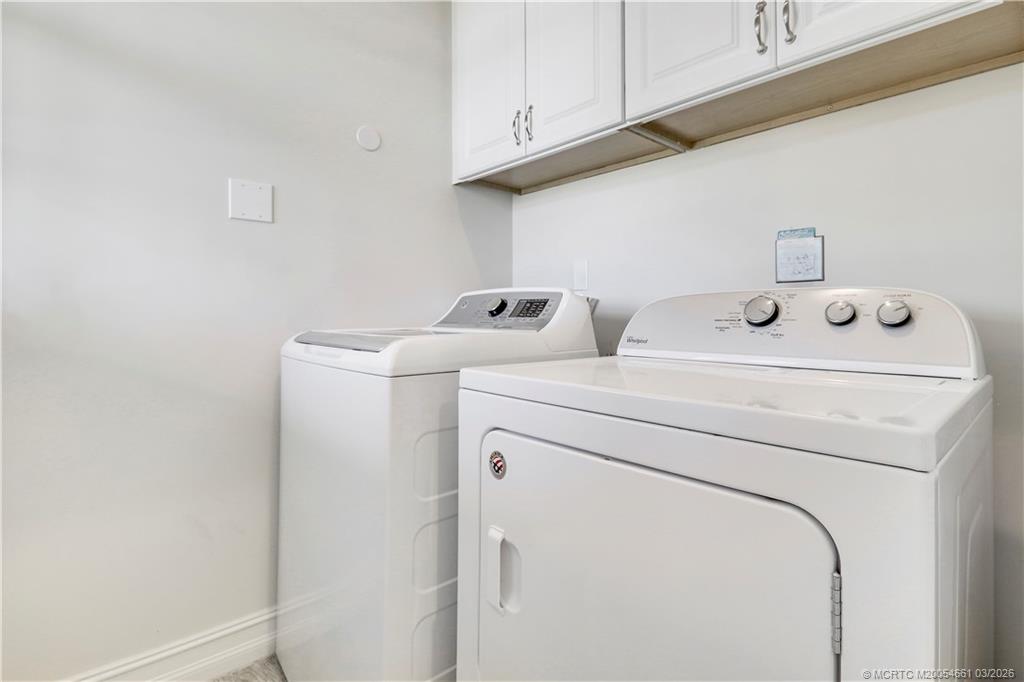 5352 Southeast Nassau Terrace Stuart, FL 34997 - Photo 34 of 53 a utility room with dryer and washer