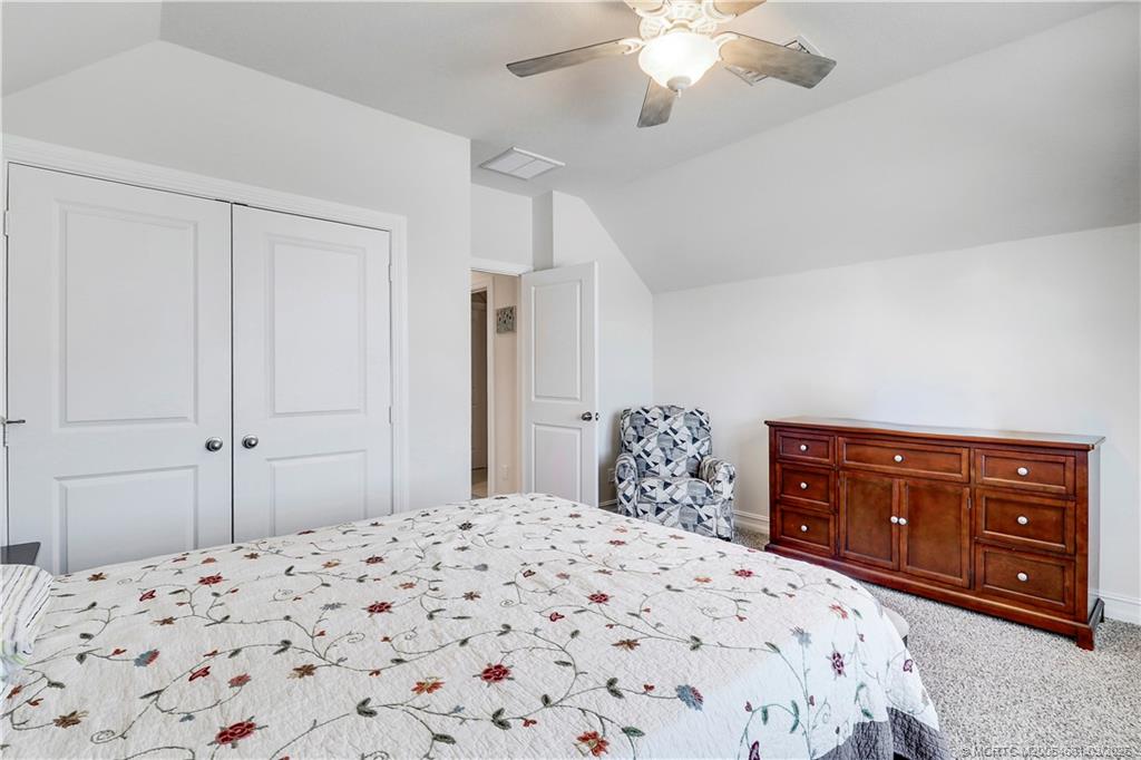 5352 Southeast Nassau Terrace Stuart, FL 34997 - Photo 36 of 53 a bedroom with a bed and a dresser
