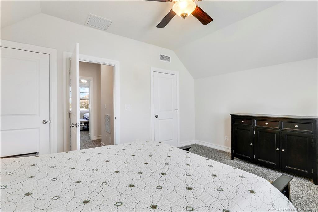 5352 Southeast Nassau Terrace Stuart, FL 34997 - Photo 38 of 53 a bedroom with a bed and a dresser