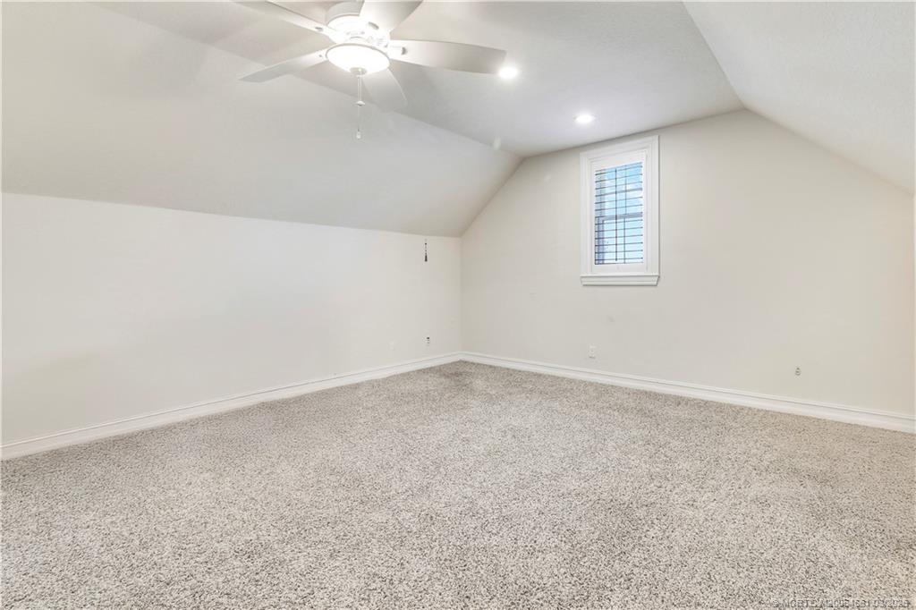 5352 Southeast Nassau Terrace Stuart, FL 34997 - Photo 40 of 53 an empty room with a chandelier fan