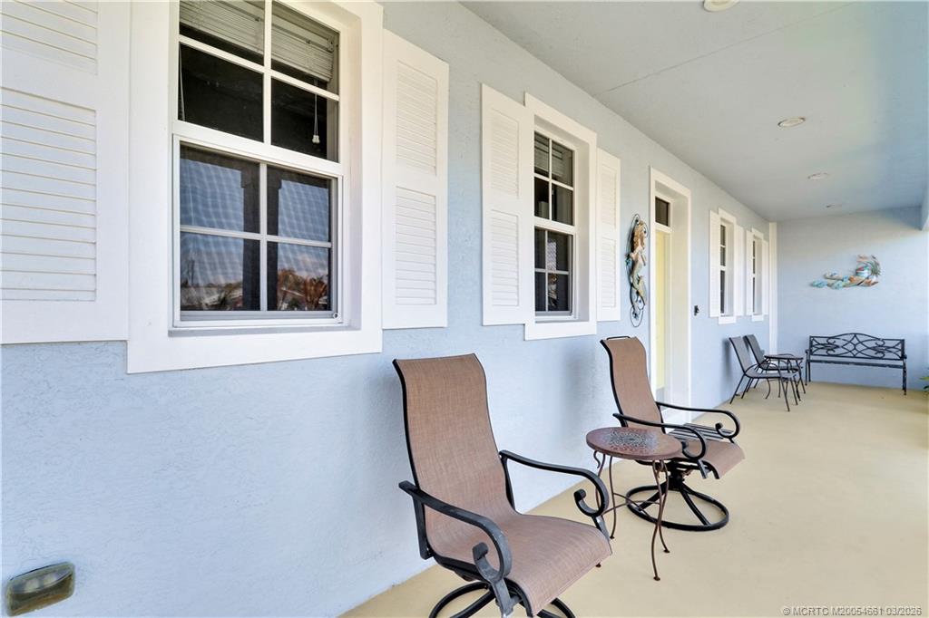 5352 Southeast Nassau Terrace Stuart, FL 34997 - Photo 4 of 53 a view of a workspace with furniture and a window