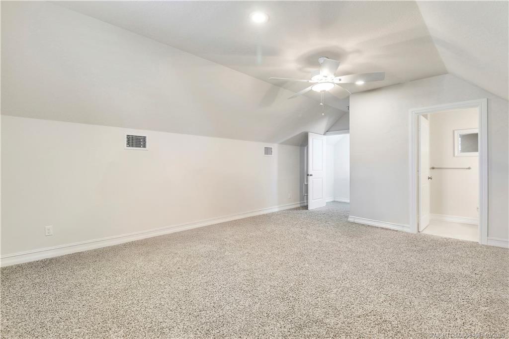 5352 Southeast Nassau Terrace Stuart, FL 34997 - Photo 41 of 53 an empty room with a ceiling fan and bathroom space