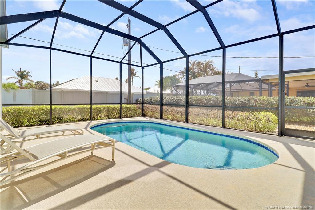 5352 Southeast Nassau Terrace Stuart, FL 34997 - Photo 43 of 53 a view of a swimming pool with a yard