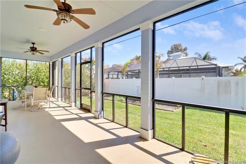 5352 Southeast Nassau Terrace Stuart, FL 34997 - Photo 46 of 53 a living room with large windows