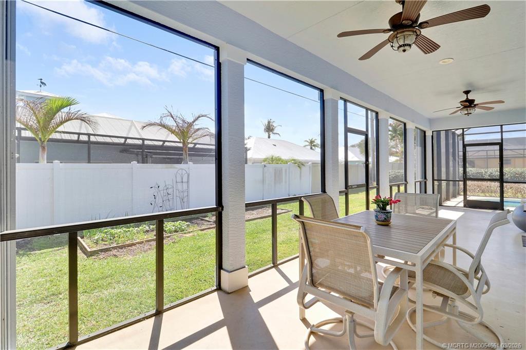 5352 Southeast Nassau Terrace Stuart, FL 34997 - Photo 47 of 53 a view of a dining room with furniture water view and a floor to ceiling window
