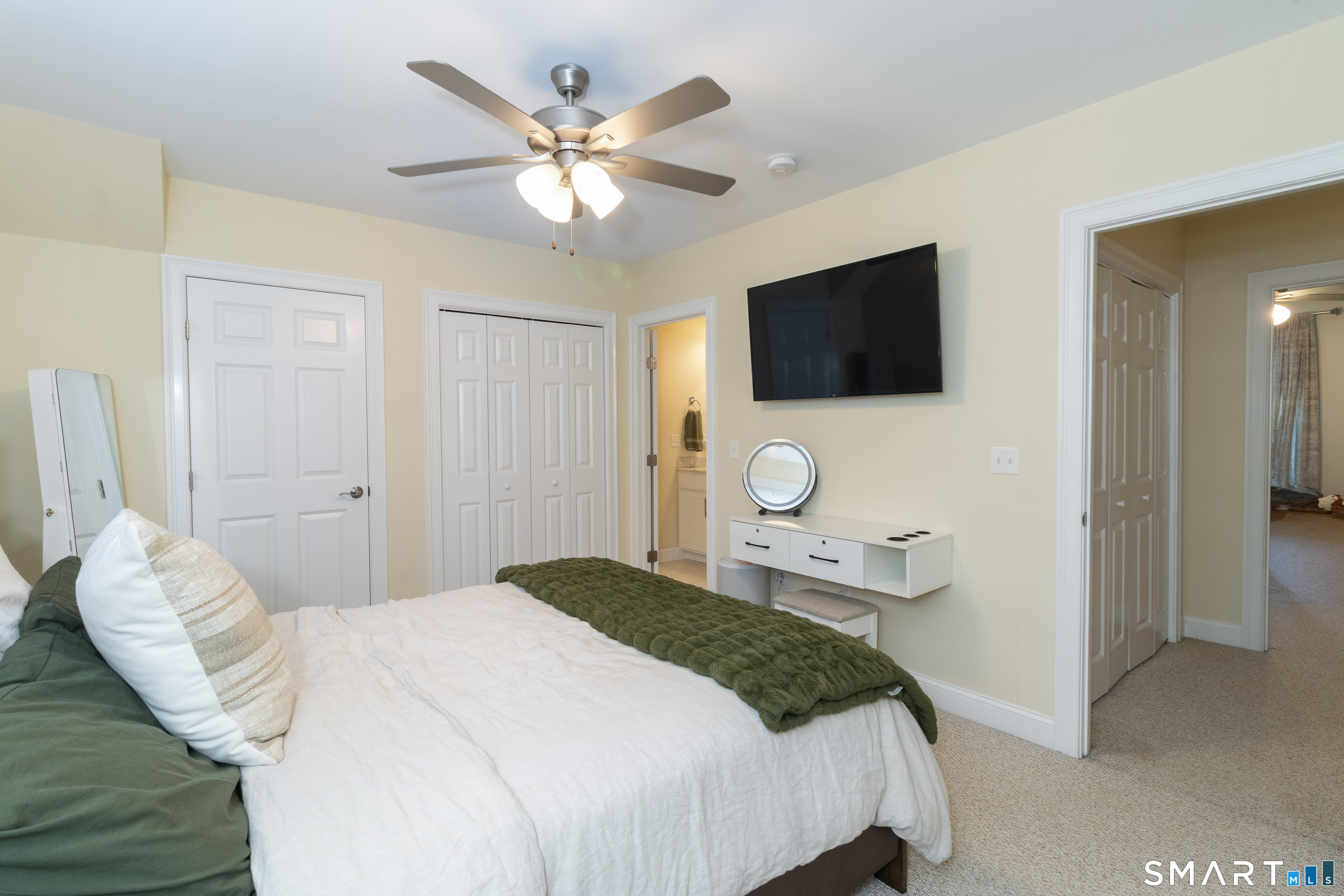 656 Bartholomew Road, Unit 656 Middletown, CT 06457 - Photo 21 of 27 a bedroom with a bed and a flat screen tv