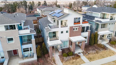 a city street with tall buildings and a street light
