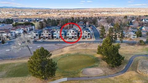a view of a house with a yard porch and sitting area