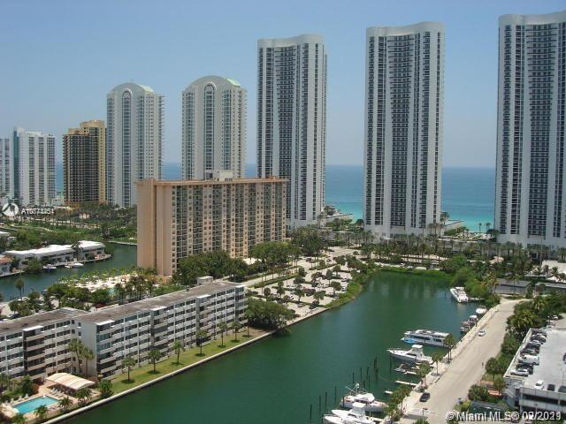 a view of a lake with tall buildings