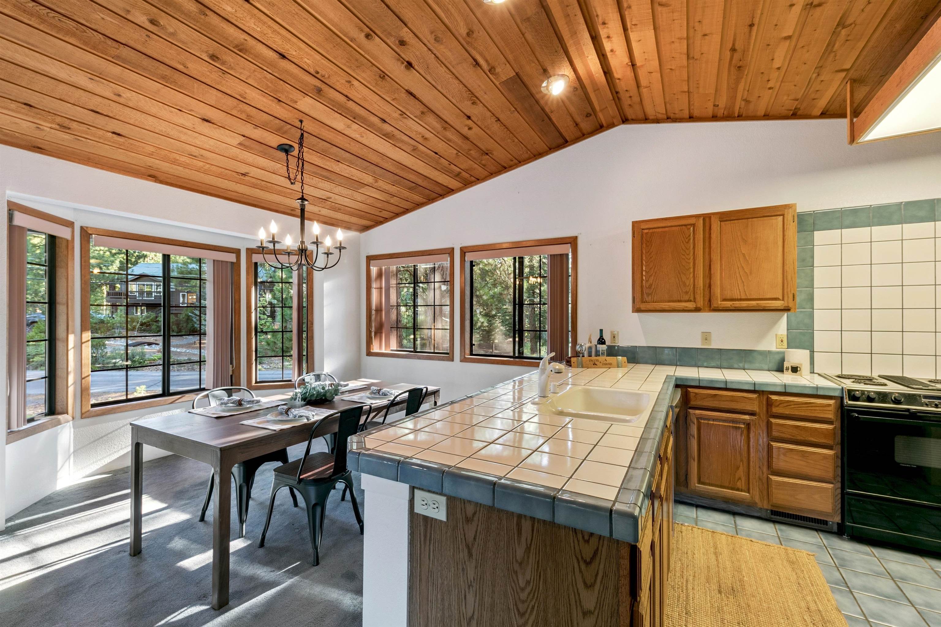 10625 Royal Crest Drive Truckee, CA 96161 - Photo 14 of 28 a kitchen with a sink and wooden cabinets