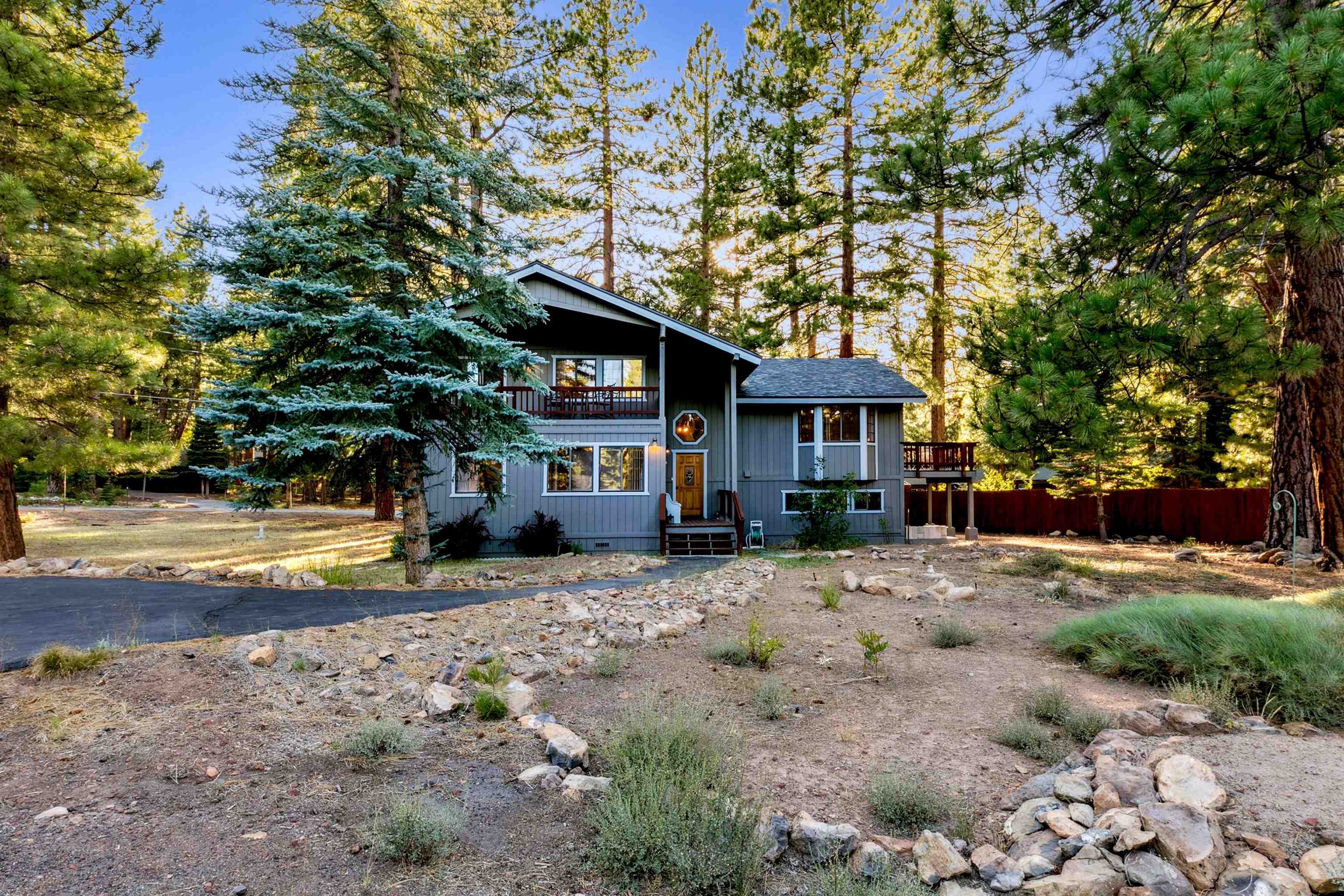 10625 Royal Crest Drive Truckee, CA 96161 - Photo 2 of 28 a front view of a house with a yard and trees