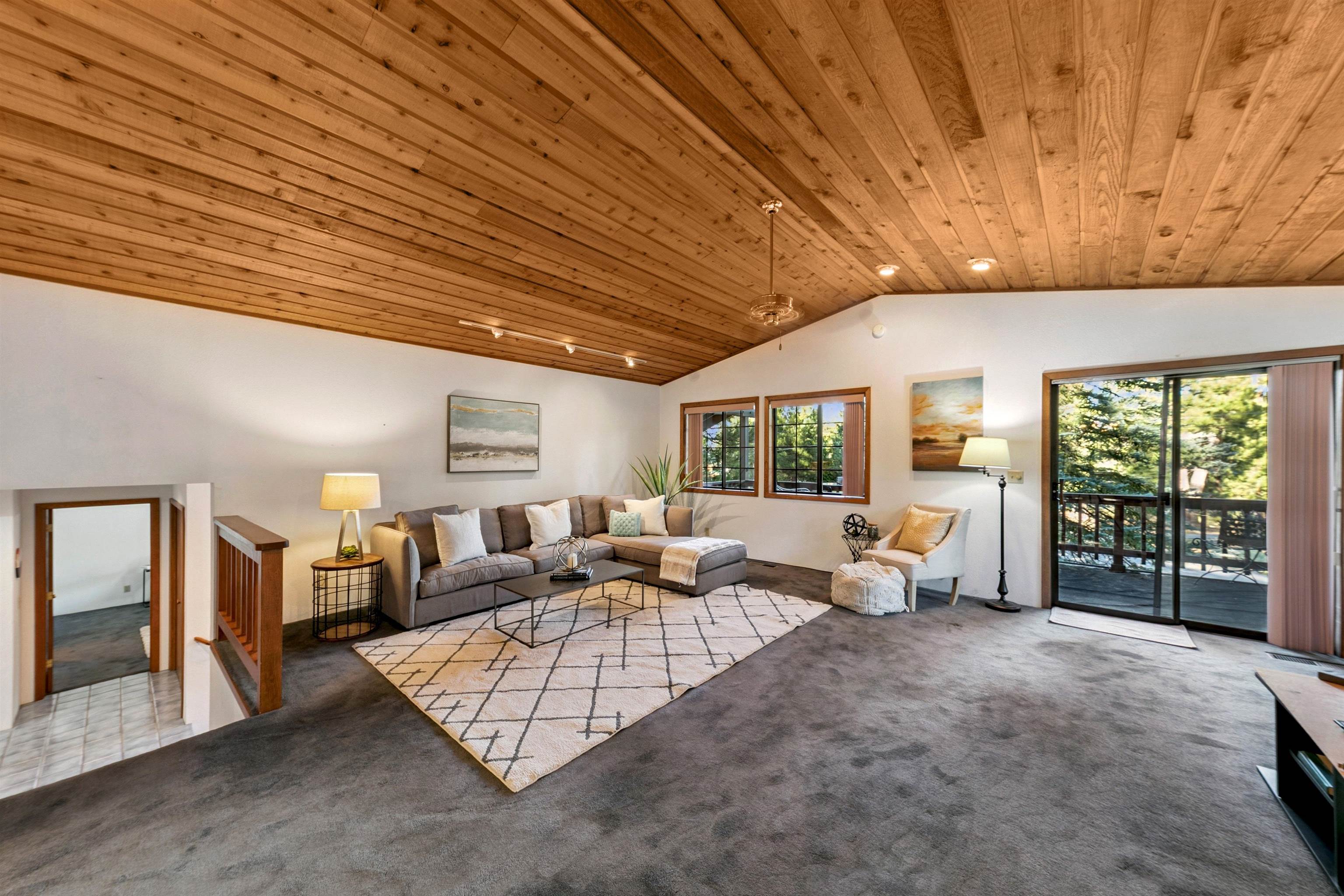 10625 Royal Crest Drive Truckee, CA 96161 - Photo 9 of 28 a living room with furniture large window and flat screen tv