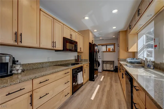 a large bed sitting in a bedroom next to a window