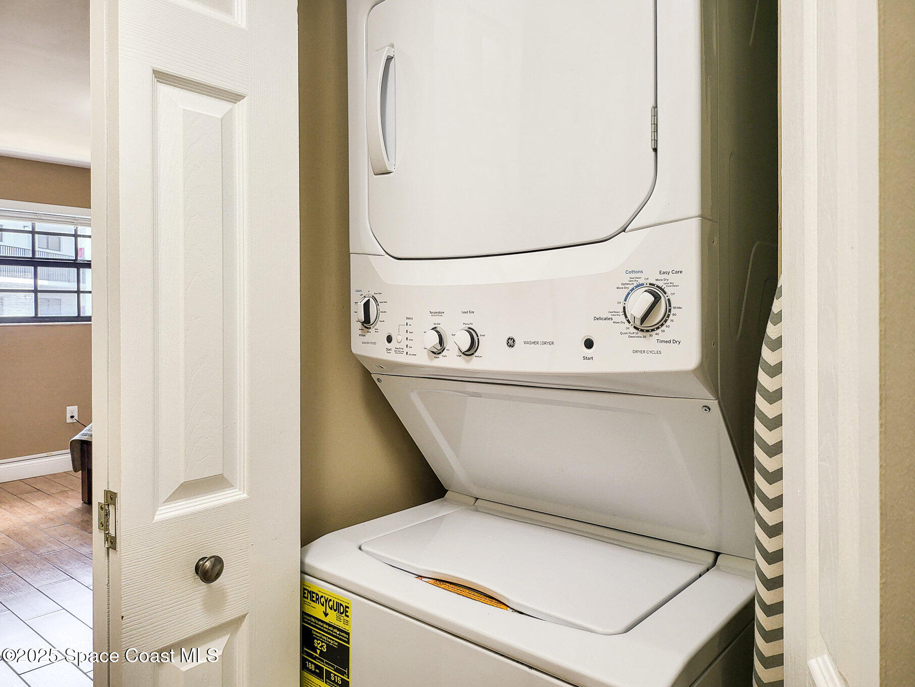 5350 Ocean Beach Boulevard, Unit 211 Cocoa Beach, FL 32931 - Photo 24 of 37 a utility room with dryer and washer