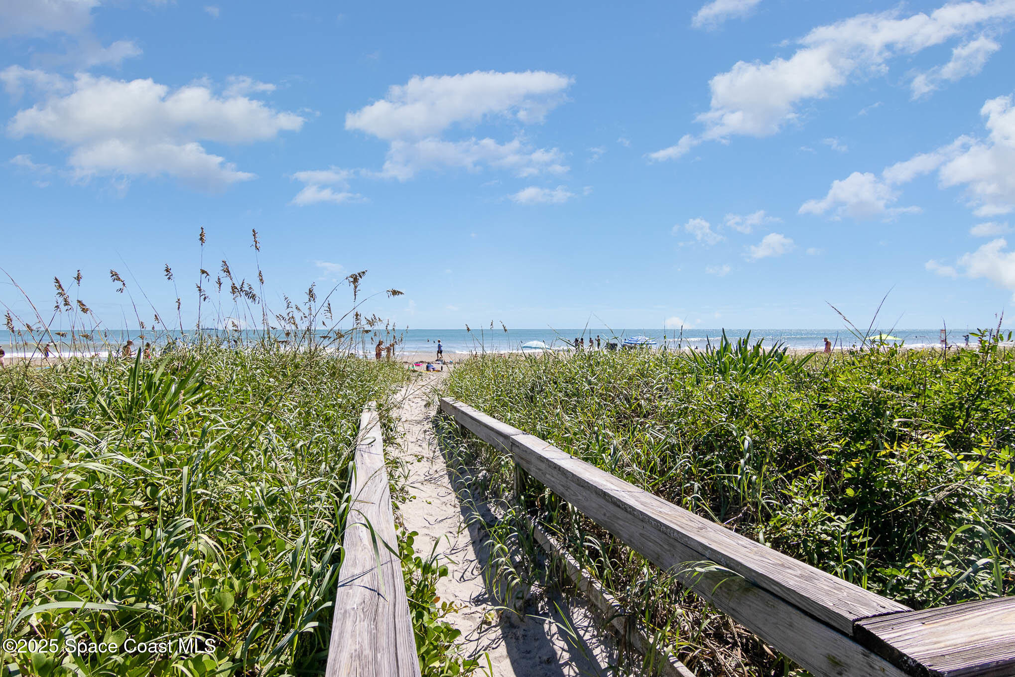 5350 Ocean Beach Boulevard, Unit 211 Cocoa Beach, FL 32931 - Photo 8 of 37 a view of a pathway both side of building