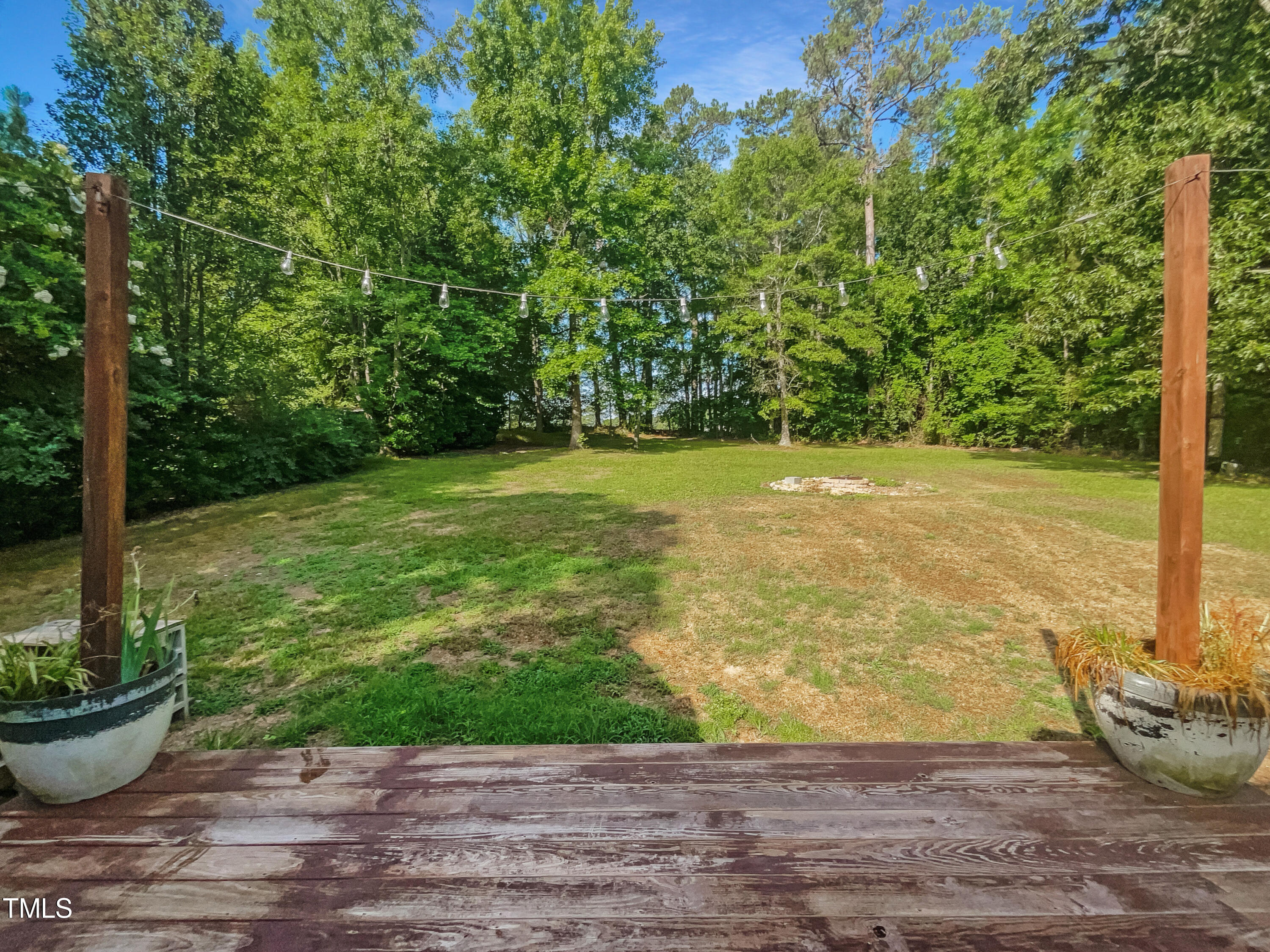 90 Carrousel Court Angier, NC 27501 - Photo 11 of 31 a view of a backyard with plants and garden