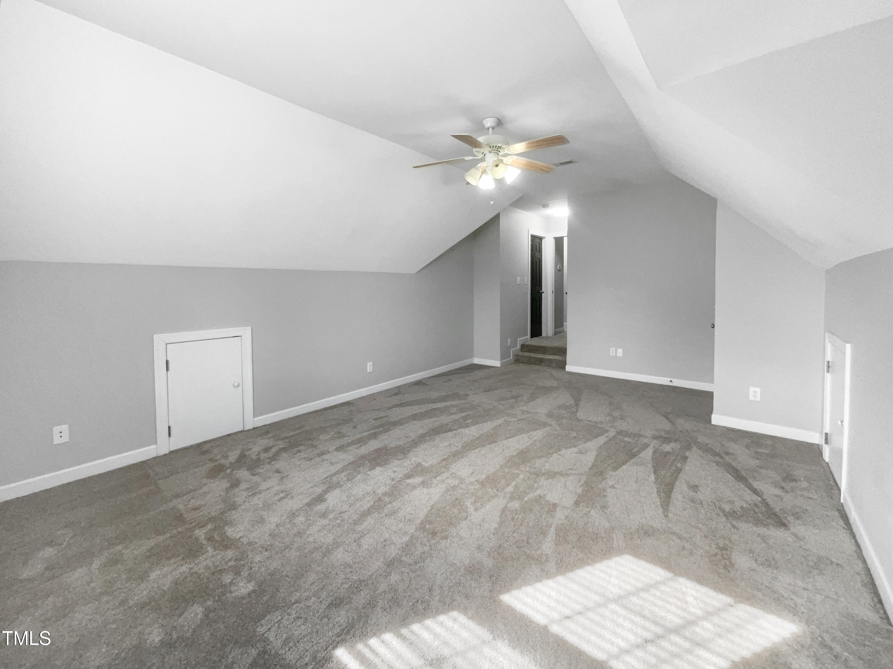 90 Carrousel Court Angier, NC 27501 - Photo 14 of 31 a view of an empty room with a chandelier fan