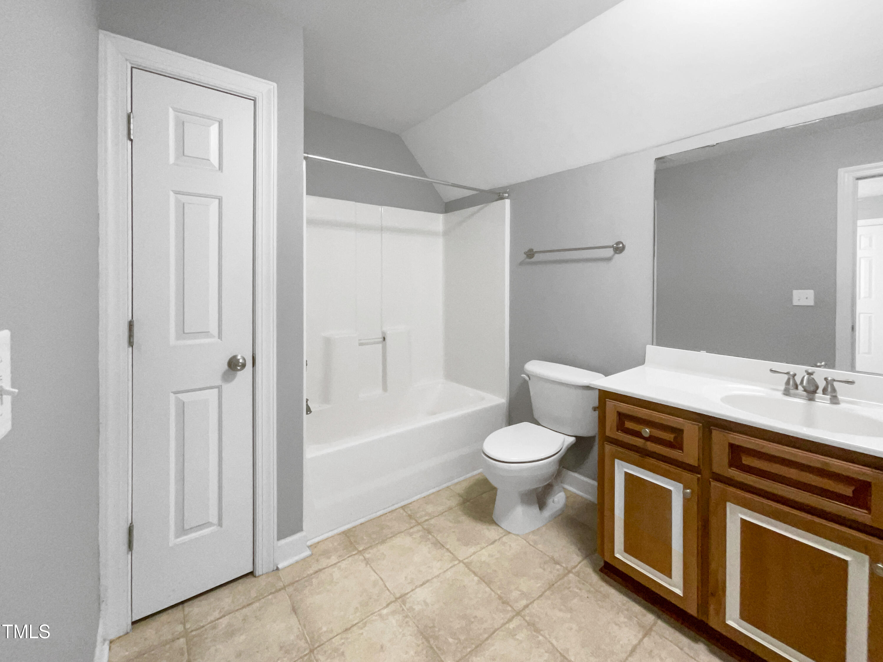 90 Carrousel Court Angier, NC 27501 - Photo 17 of 31 a bathroom with a granite countertop toilet a sink and a bathtub