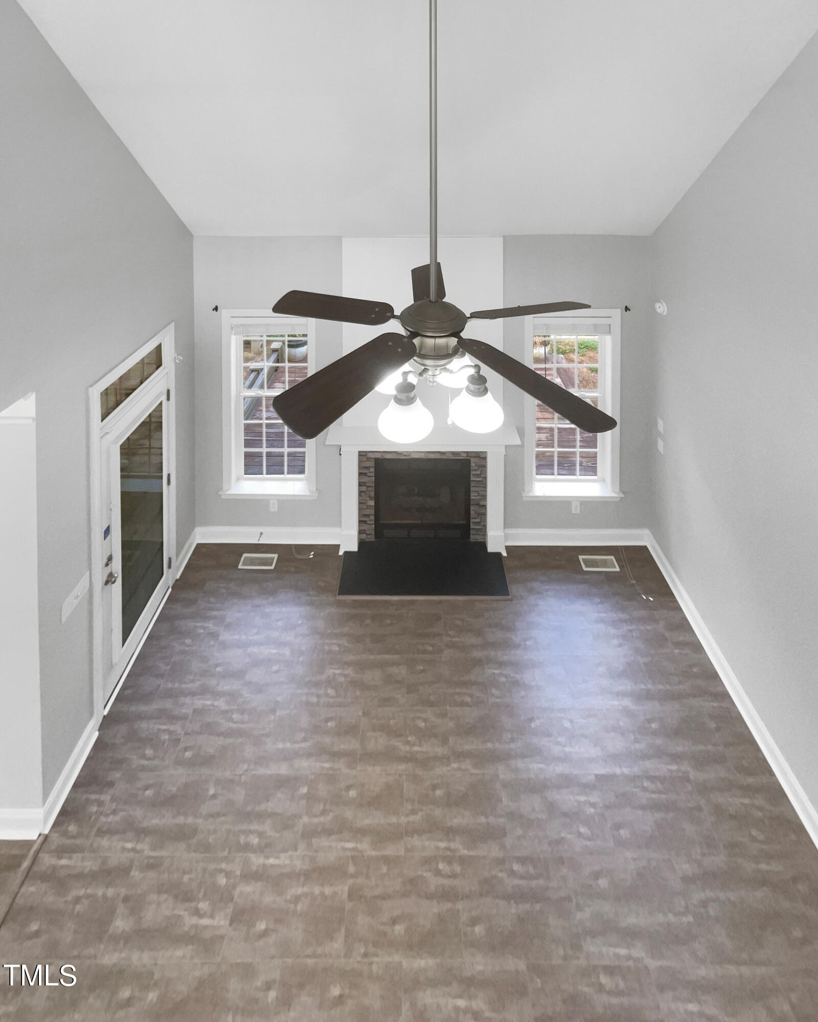 90 Carrousel Court Angier, NC 27501 - Photo 20 of 31 a view of a livingroom with wooden floor a ceiling fan and windows