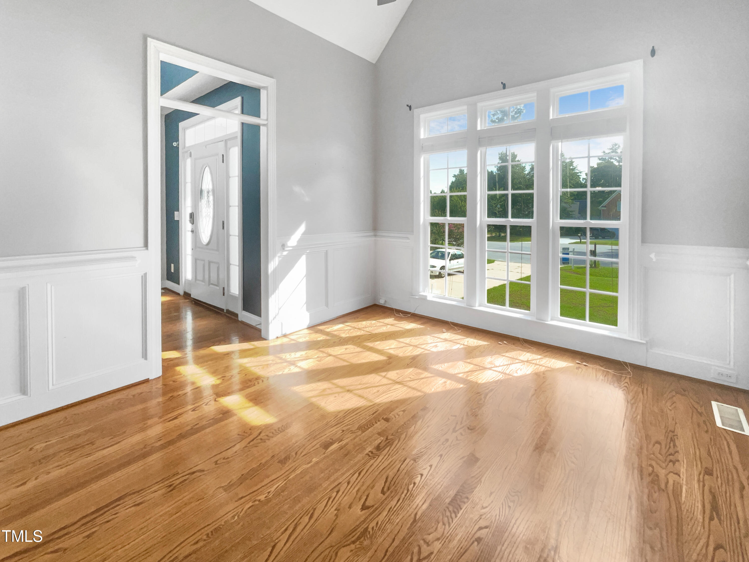 90 Carrousel Court Angier, NC 27501 - Photo 21 of 31 a view of an empty room with wooden floor and a window
