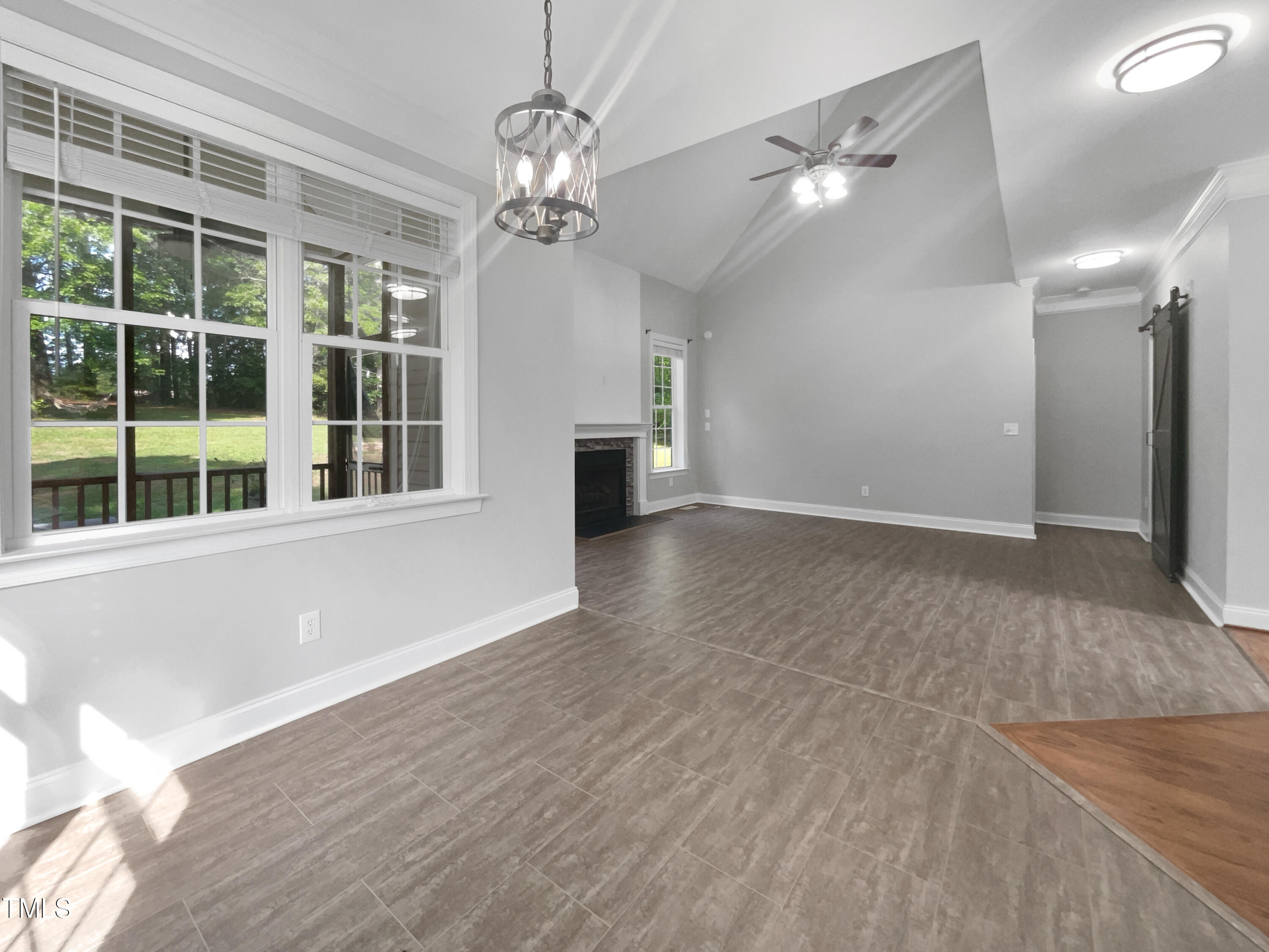 90 Carrousel Court Angier, NC 27501 - Photo 24 of 31 a view of empty room with wooden floor and fan