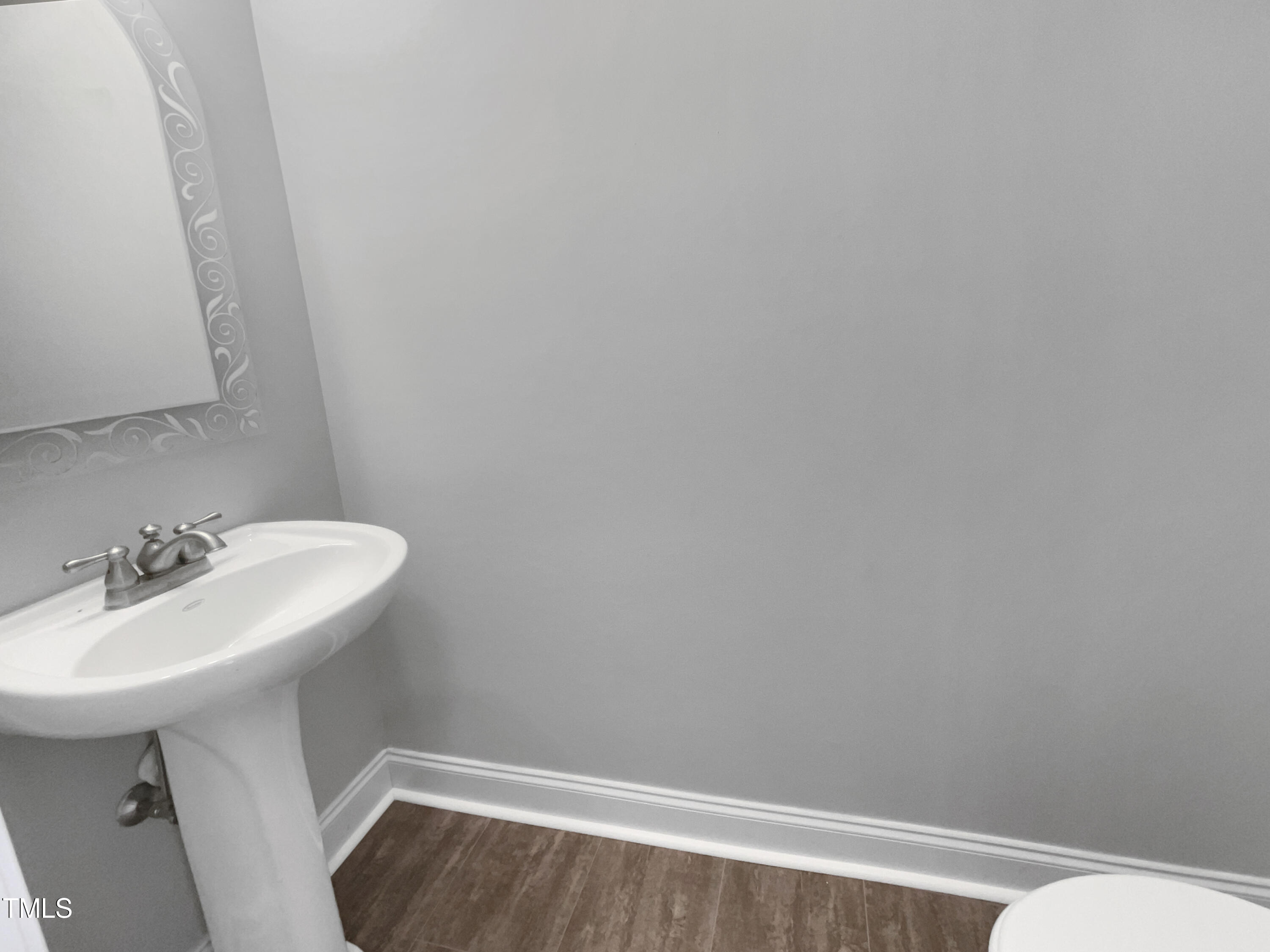 90 Carrousel Court Angier, NC 27501 - Photo 28 of 31 a bathroom with a sink a toilet and mirror