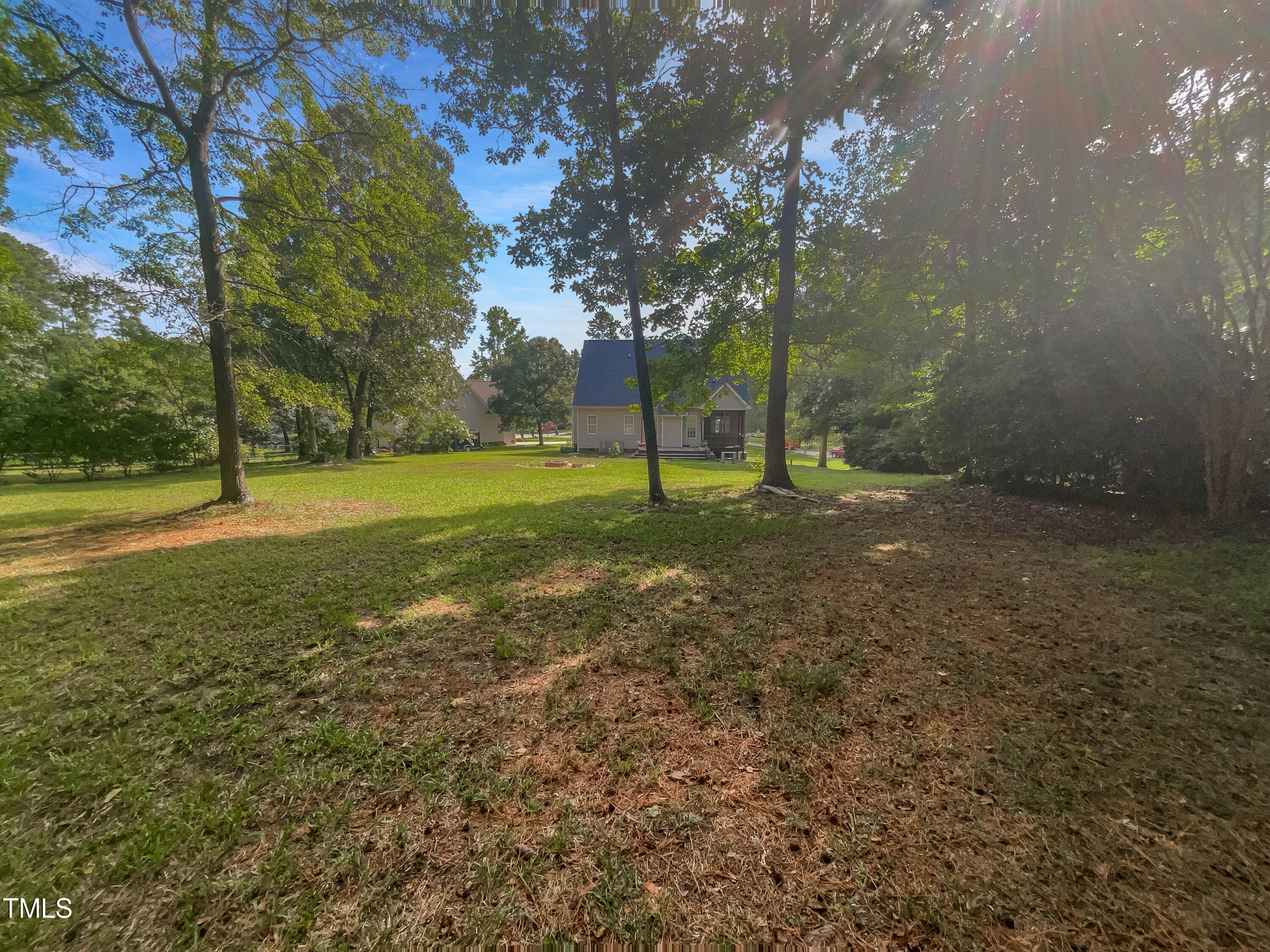 90 Carrousel Court Angier, NC 27501 - Photo 10 of 31 a view of a field with tree s