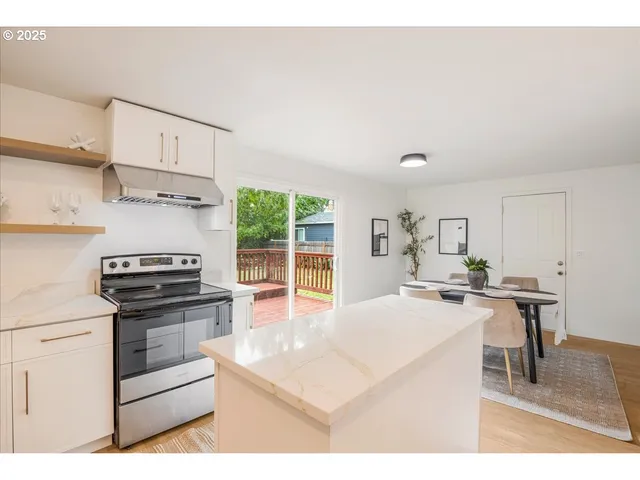 a kitchen with cabinets and appliances