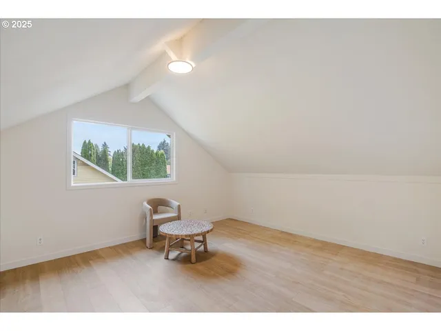 a view of an empty room and a window