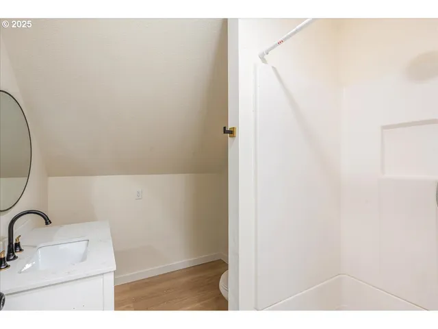 a bathroom with a sink and mirror